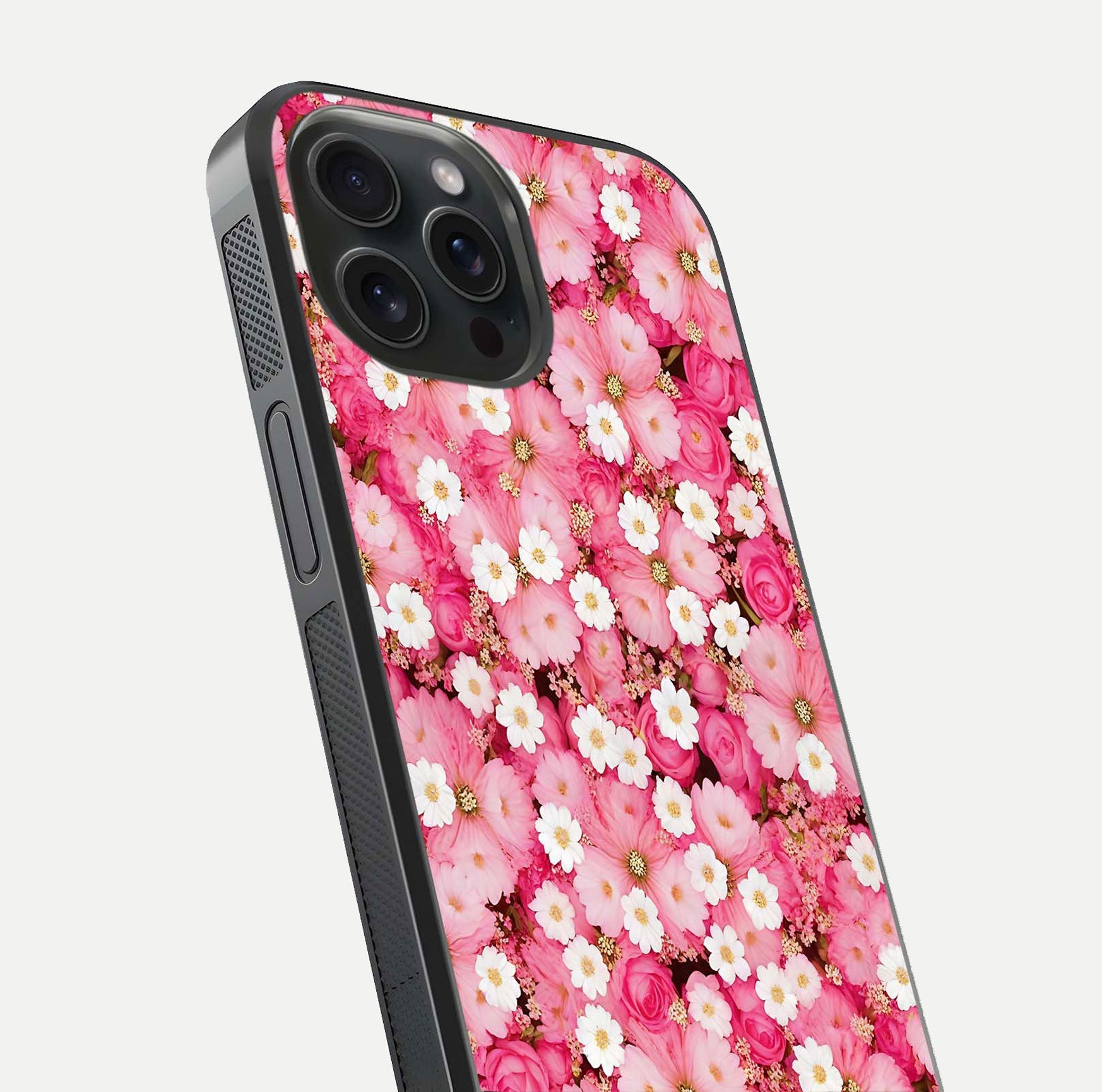 Pink Daisy Bliss Glass Case for iPhone 15 Pro close-up angled shot highlighting daisy detail and reflection glow