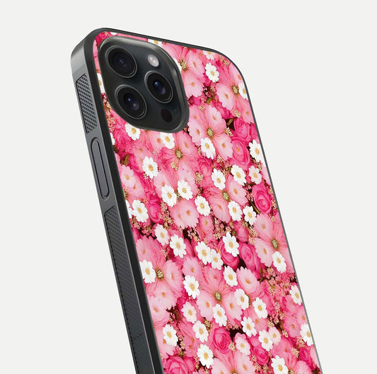 Pink Daisy Bliss Glass Case for iPhone 15 Pro close-up angled shot highlighting daisy detail and reflection glow
