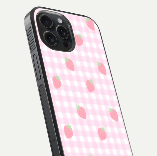 Strawberry Picnic Love iPhone 15 Pro glass phone case angled back view highlighting strawberry illustrations and textured grip