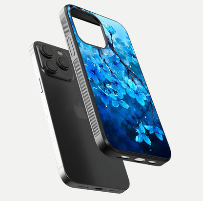 Blue Blossoms Branch Glass Case for iPhone 15 Pro floating mockup showing shine, curved edges, and branch detailing