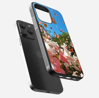 Butterflies in Bloom Sky Glass Case for iPhone 15 Pro floating mockup capturing butterfly motion and edge design