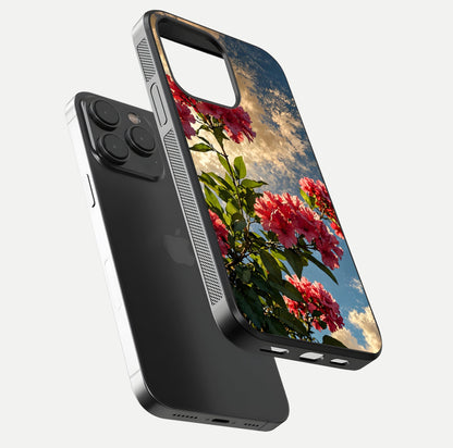 Red Bloom Skies Glass Case for iPhone 15 Pro floating dual-view mockup showing glass gloss and floral pattern