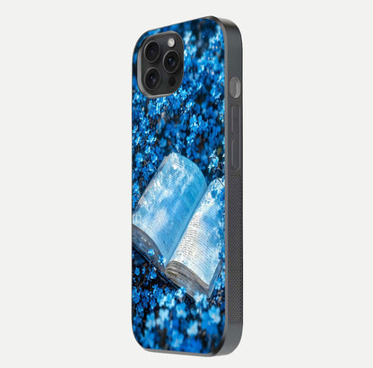Blue Bloom Tales Glass Case for iPhone 15 Pro side-angle image showing blue floral pattern and glossy finish