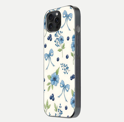 Blue Flower & Bow Glass Case for iPhone 15 Pro side-angle image showing bow-floral mix and HD finish shine
