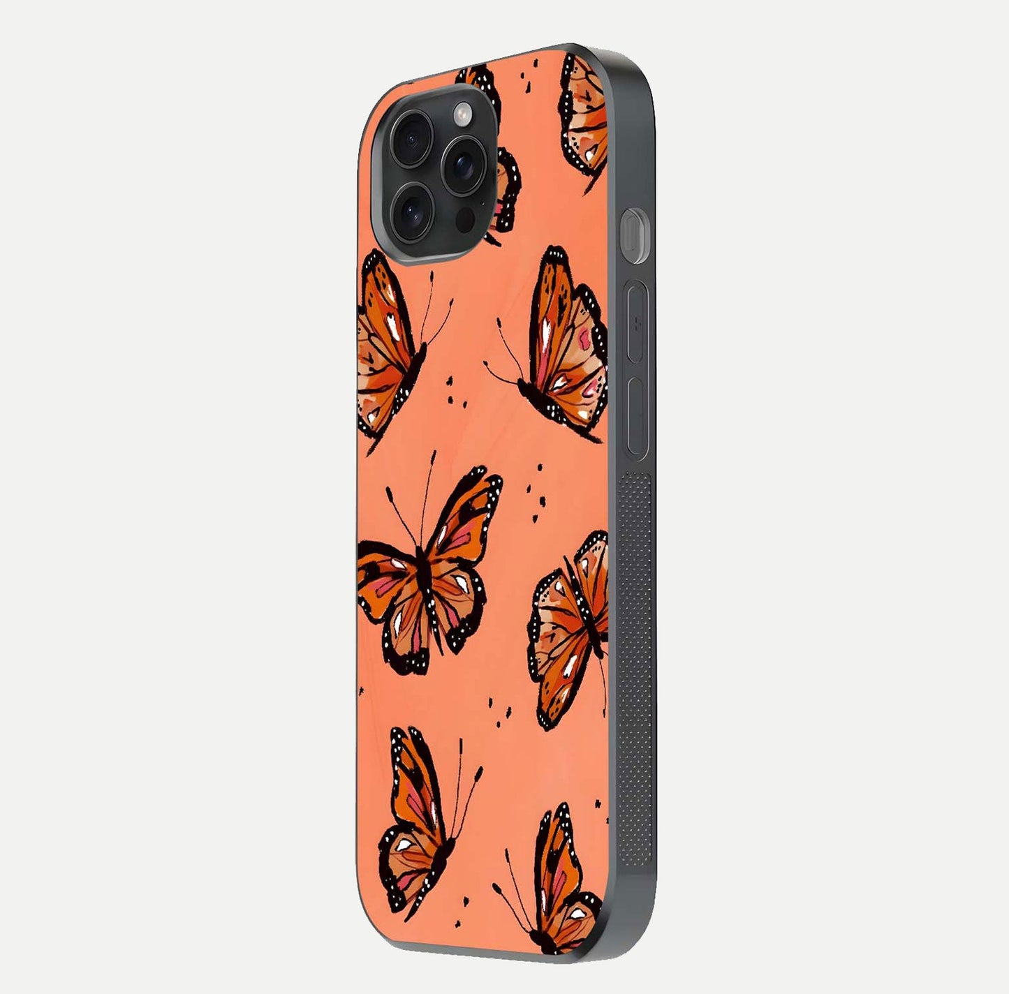 Coral Wing Butterfly Glass Case for iPhone 15 Pro side-angle photo showing reflective finish and smooth edges