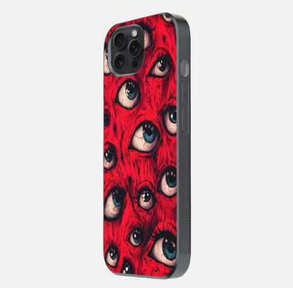 Crimson Watch Eyes Glass Case for iPhone 15 Pro side-angle photo showing reflection texture and shine
