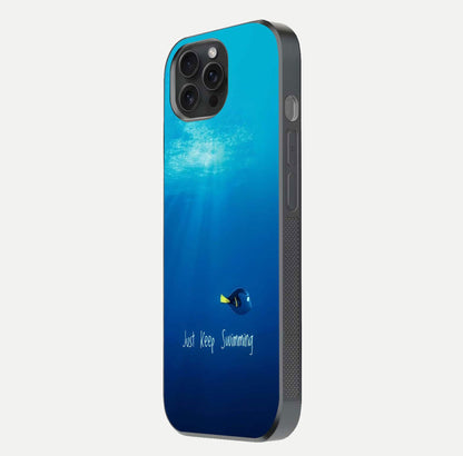 Just Keep Swimming Glass Case for iPhone 15 Pro side-angle image highlighting reflective surface and positive quote