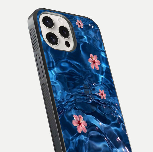 Blooming Water Drift Glass Case for iPhone 15 Pro Max close-up angle showing petal details, soft aqua tones, and smooth gloss reflection