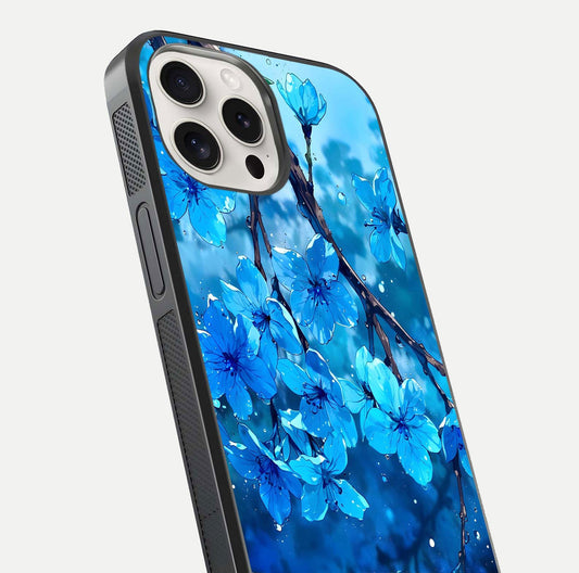 Blue Blossoms Branch Glass Case for iPhone 15 Pro Max close-up angle highlighting petal details and reflection gloss