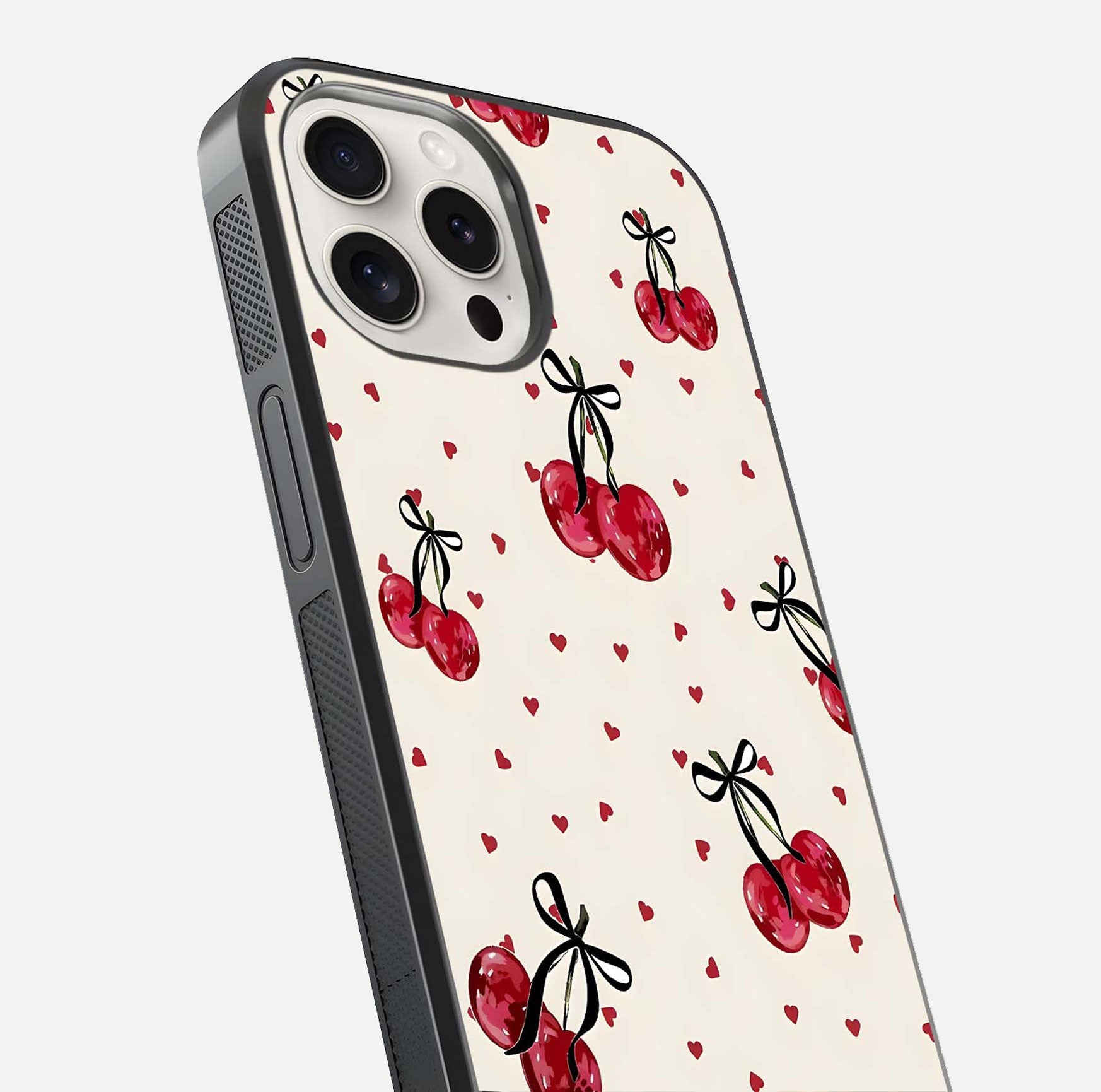 Cherry Heart Bow Glass Case for iPhone 15 Pro Max close-up highlighting small bows, cherry red tones, and gloss shine