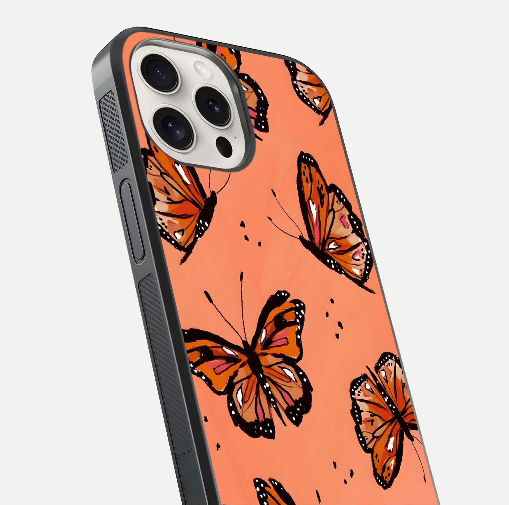 Coral Wing Butterfly Glass Case for iPhone 15 Pro Max close-up highlighting wing pattern, coral tones, and reflection shine