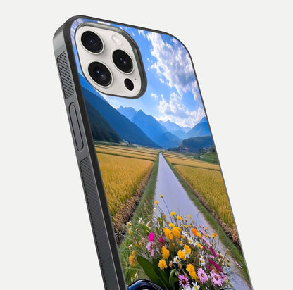 Golden Field Journey Glass Case for iPhone 15 Pro Max close-up angled shot showing sunlight tones and reflection clarity
