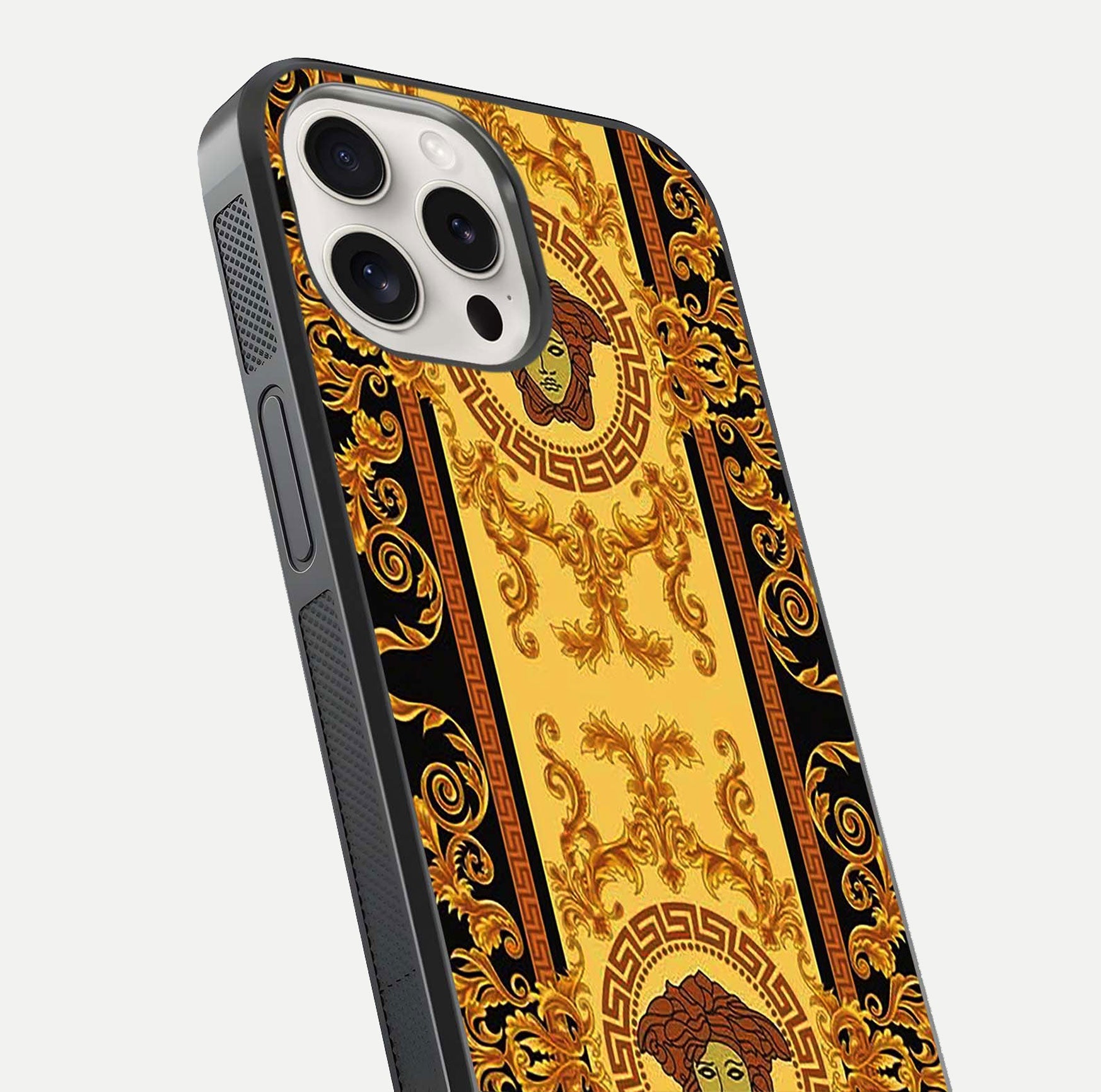 Golden Royal Heritage Glass Case for iPhone 15 Pro Max close-up angled shot showing intricate design and metallic reflection