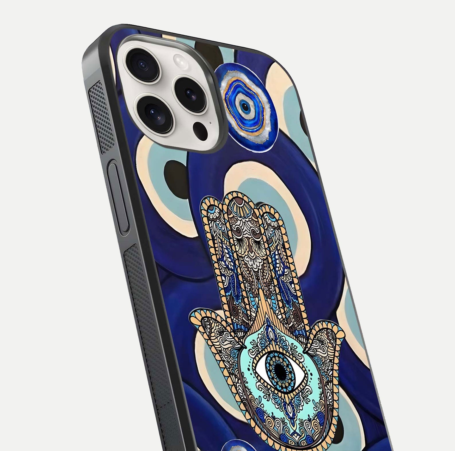 Hamsa Divine Guard Glass Case for iPhone 15 Pro Max close-up angled shot showing detailed palm motif and reflection glow