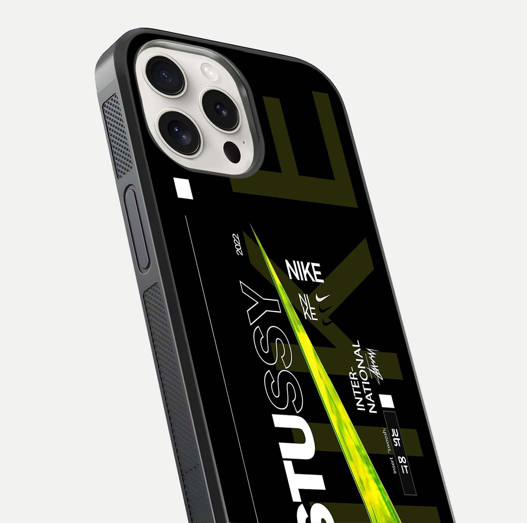 Neon Street Edition Glass Case for iPhone 15 Pro Max close-up angled shot showing urban neon lights and shine