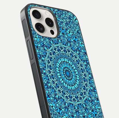 Ocean Bloom Mandala Glass Case for iPhone 15 Pro Max close-up angled shot highlighting detailed mandala and reflection