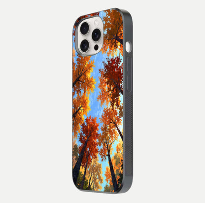 Autumn Sky Rise Glass Case for iPhone 15 Pro Max side-angle showing autumn art tones and protective corners