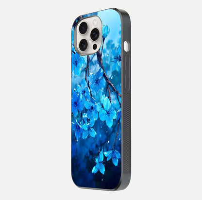 Blue Blossoms Branch Glass Case for iPhone 15 Pro Max side-angle image showing blossom pattern flow and glossy texture