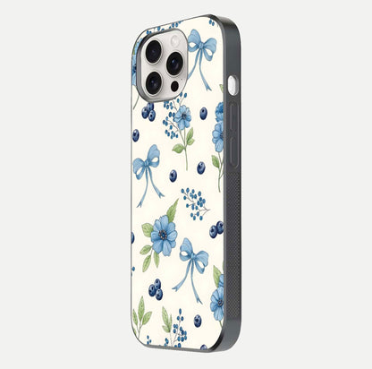 Blue Flower & Bow Glass Case for iPhone 15 Pro Max side-angle image showing bow-floral mix and HD finish shine
