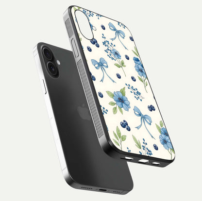 Blue Flower & Bow Glass Case for iPhone 16 floating mockup capturing gloss reflection and girly aesthetic