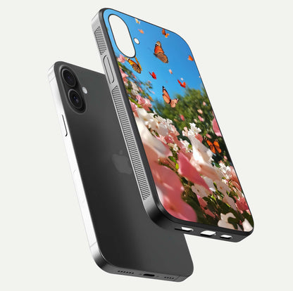 Butterflies in Bloom Sky Glass Case for iPhone 16 floating mockup capturing butterfly motion and edge design