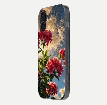 Red Bloom Skies Glass Case for iPhone 16 side-angle image showing reflection, print clarity, and tone blend