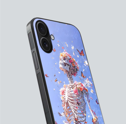 Bloom Beyond Bones Glass Case for iPhone 16 close-up highlighting unique bone-floral fusion art and reflection