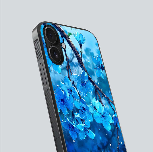 Blue Blossoms Branch Glass Case for iPhone 16 close-up angle highlighting petal details and reflection gloss