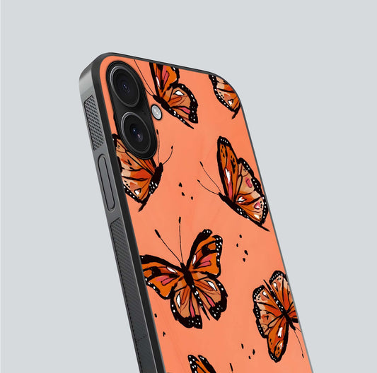 Coral Wing Butterfly Glass Case for iPhone 16 close-up highlighting wing pattern, coral tones, and reflection shine
