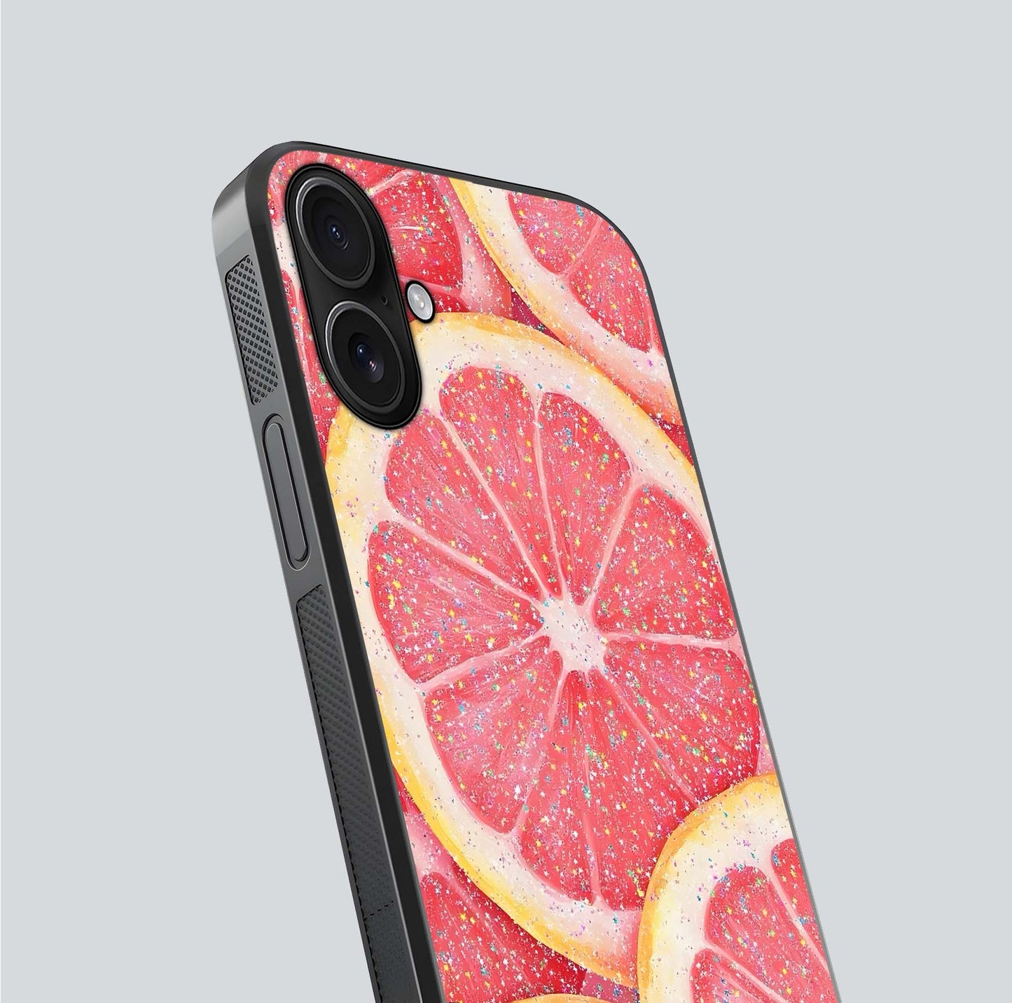 Glitter Grapefruit Glass Case for iPhone 16 close-up angled shot showing fruit texture and glitter reflection