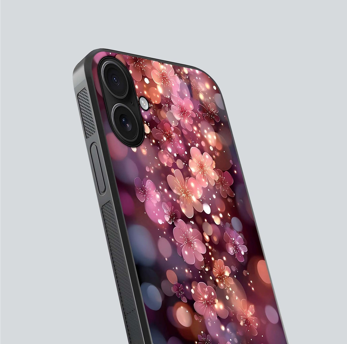 Glowing Petal Bliss Glass Case for iPhone 16 close-up angled shot showing petal glow, color depth, and reflection shine