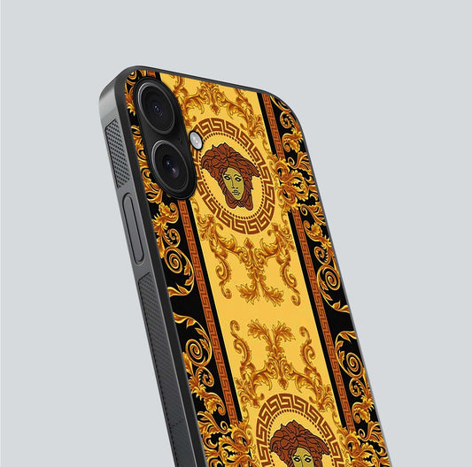 Golden Royal Heritage Glass Case for iPhone 16 close-up angled shot showing intricate design and metallic reflection