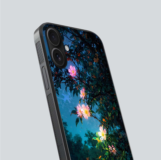 Midnight Bloom Glow Glass Case for iPhone 16 close-up angled shot showing petal highlights and glow reflection