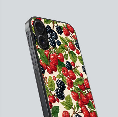 Mixed Berry Collage Glass Case for iPhone 16 close-up angled shot showing fruit detail and reflection glow