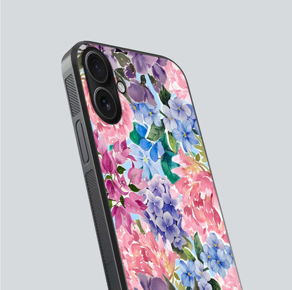 Pastel Floral Mix Glass Case for iPhone 16 close-up angled shot highlighting flower detail and reflection