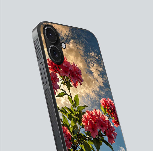 Red Bloom Skies Glass Case for iPhone 16 close-up angled shot highlighting detailed blooms and reflection