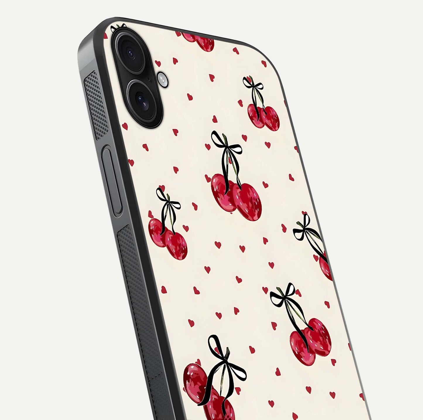 Cherry Heart Bow Glass Case for iPhone 16 Plus close-up highlighting small bows, cherry red tones, and gloss shine