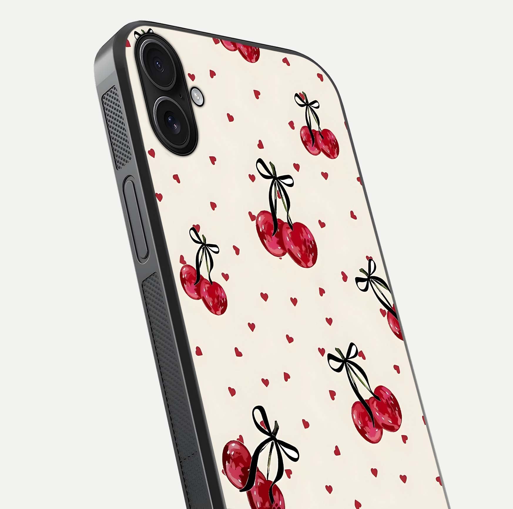 Cherry Heart Bow Glass Case for iPhone 16 Plus close-up highlighting small bows, cherry red tones, and gloss shine