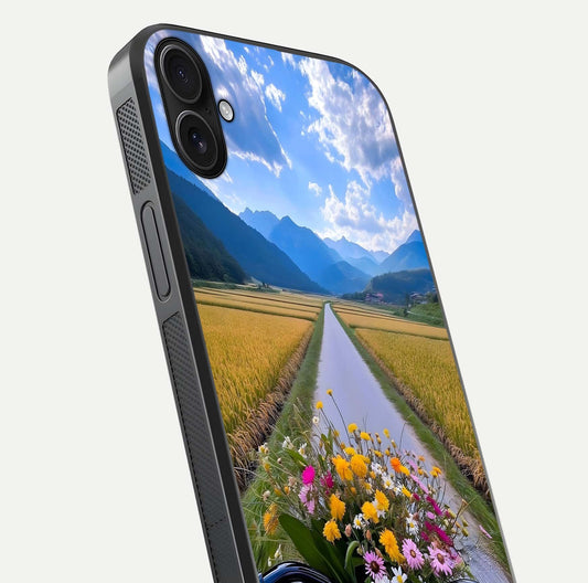 Golden Field Journey Glass Case for iPhone 16 Plus close-up angled shot showing sunlight tones and reflection clarity