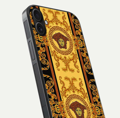 Golden Royal Heritage Glass Case for iPhone 16 Plus close-up angled shot showing intricate design and metallic reflection