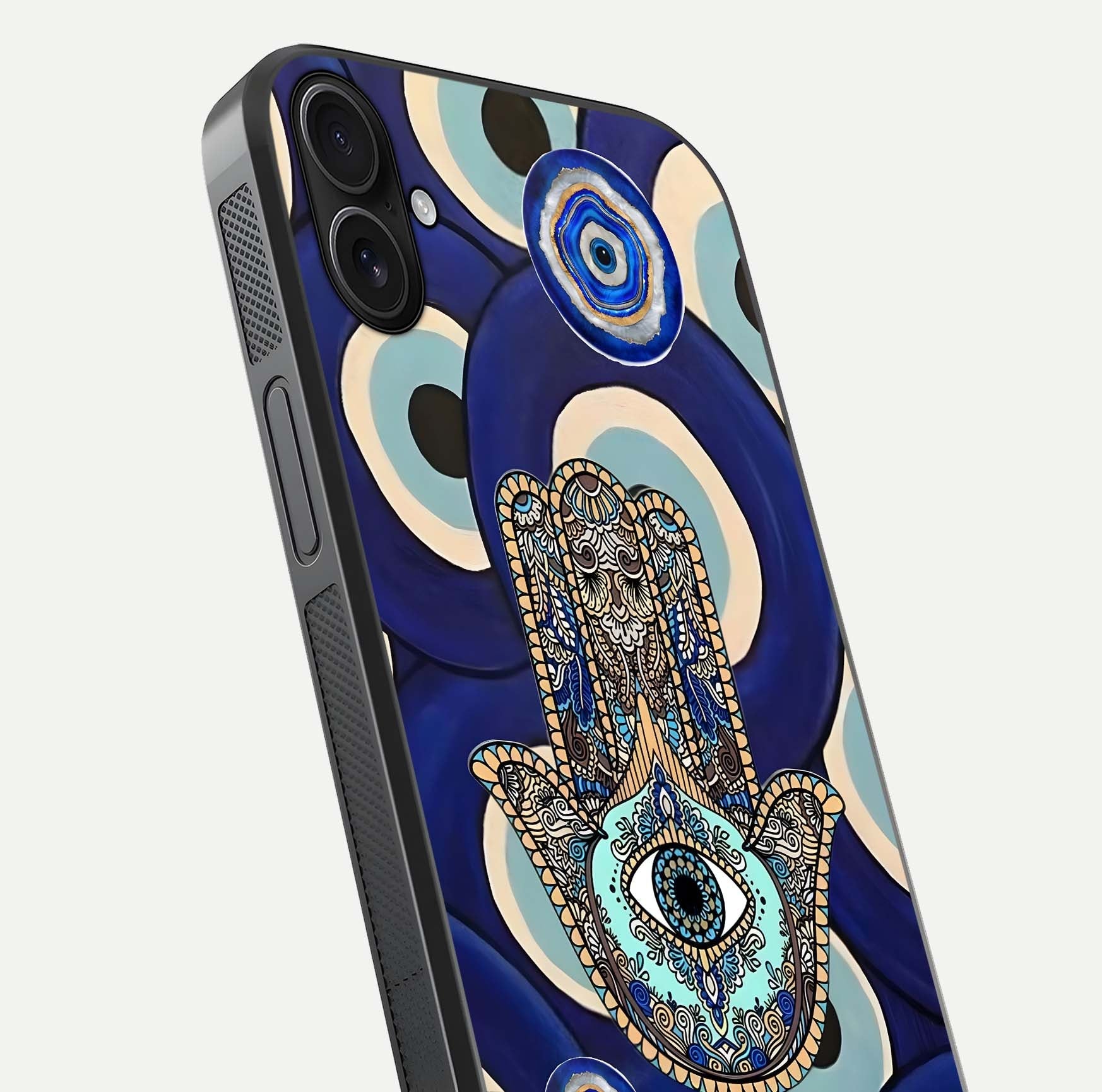 Hamsa Divine Guard Glass Case for iPhone 16 Plus close-up angled shot showing detailed palm motif and reflection glow