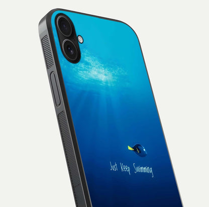 Just Keep Swimming Glass Case for iPhone 16 Plus close-up angled shot showing elegant lettering and blue tone reflection