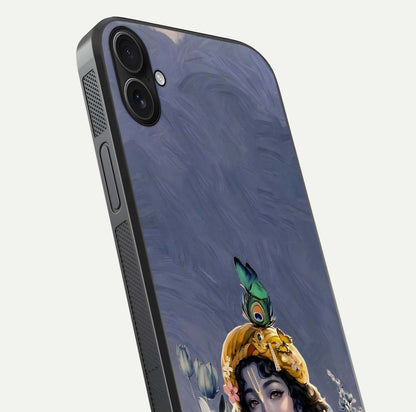 Lord Krishna Glass Case for iPhone 16 Plus angled close-up showing intricate flute and reflection details