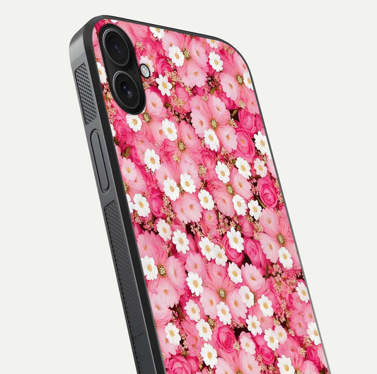 Pink Daisy Bliss Glass Case for iPhone 16 Plus close-up angled shot highlighting daisy detail and reflection glow