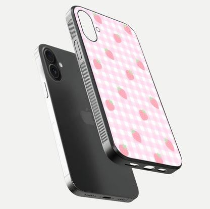 Strawberry Picnic Love iPhone 16 Plus glass phone case floating view emphasizing glossy finish and playful charm
