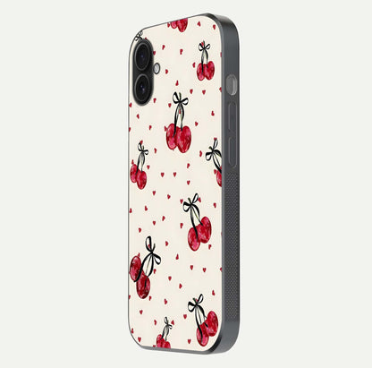 Cherry Heart Bow Glass Case for iPhone 16 Plus side-angle image capturing gloss texture and charm bow art