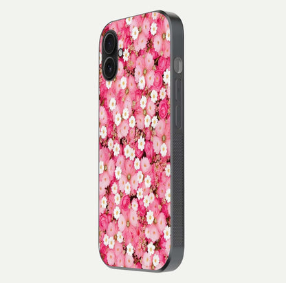 Pink Daisy Bliss Glass Case for iPhone 16 Plus side-angle image showing delicate daisy pattern and glass reflection