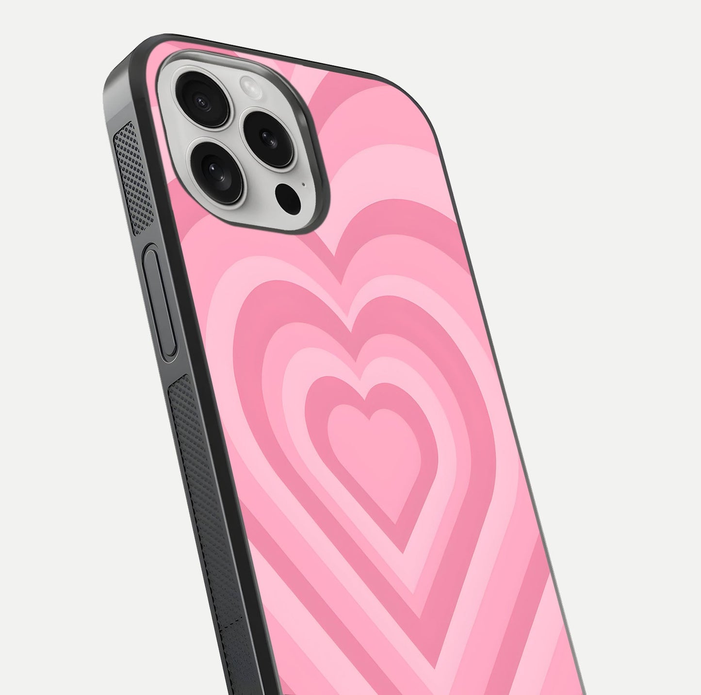 Blush Heart Waves iPhone 16 Pro glass phone case angled back view highlighting romantic heart wave artwork and grip texture