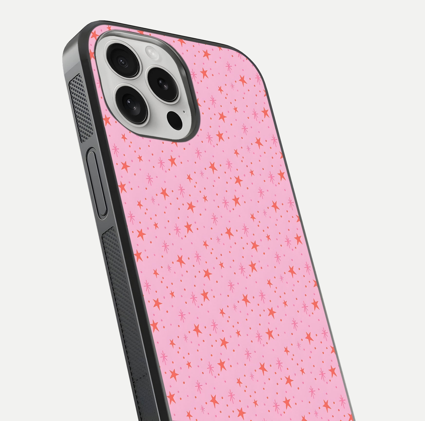 Cosmic Pink Sparkle iPhone 16 Pro glass phone case angled back view highlighting sparkling galaxy design and textured side grip