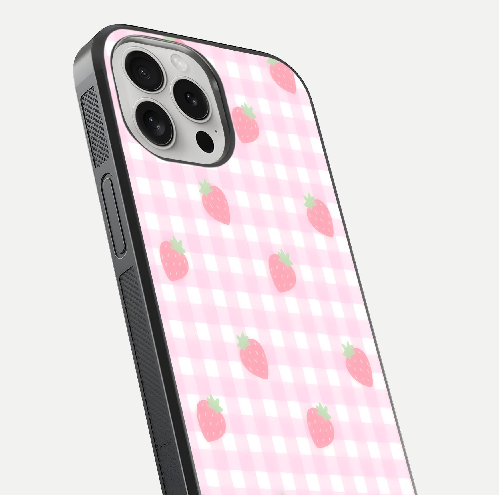 Strawberry Picnic Love iPhone 16 Pro glass phone case angled back view highlighting strawberry illustrations and textured grip